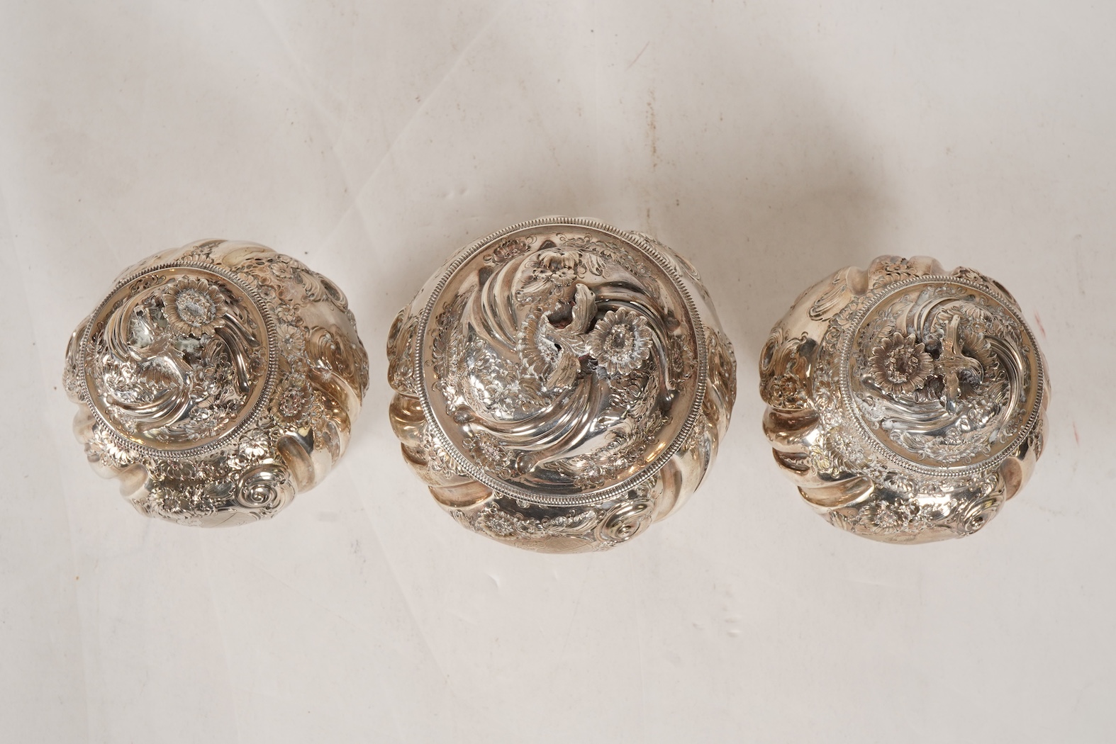 A pair of George II silver tea caddies and matching sugar box with covers, by Samuel Taylor